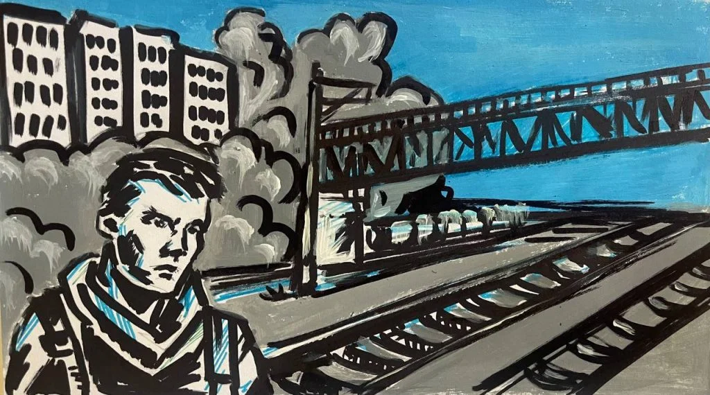 Чоловік біля мосту через залізницю.